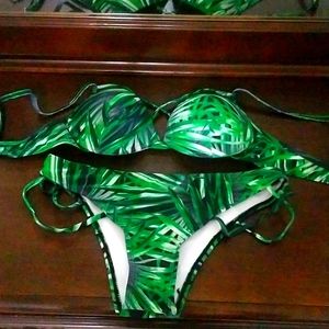 Small green bikini bathing suit set with pattern. Never worn.